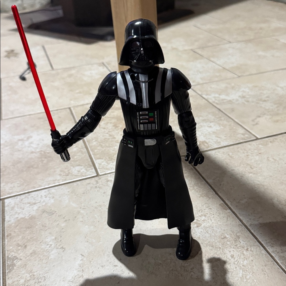 Black and Silver Action Figure with Red Accessory